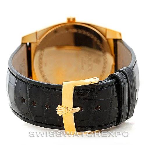 The image shows the back view of a Rolex Cellini 5330 Men's Yellow Gold White Dial 5330 Men's Yellow Gold White Dial watch, focusing on the leather strap and the gold buckle with the Rolex crown logo.