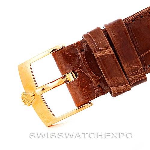 The image shows a close-up of the buckle and leather strap of a Rolex Cellini 5116 Men's Yellow Gold Champagne Dial 5116 Men's Yellow Gold Champagne Dial watch.