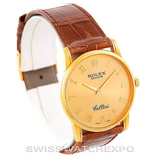 This image shows the Rolex Cellini 5116 Men's Yellow Gold Champagne Dial 5116 Men's Yellow Gold Champagne Dial watch at a three-quarter angle, highlighting the gold watch case, face, and brown leather strap.