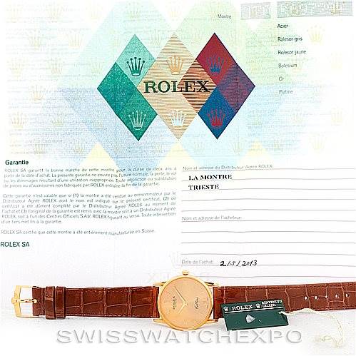 The image shows a Rolex Cellini 5116 Men's Yellow Gold Champagne Dial 5116 Men's Yellow Gold Champagne Dial watch laid flat with its strap extended, along with its warranty and certification papers.