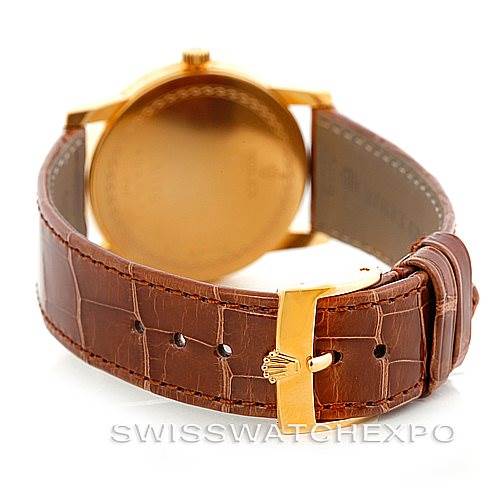 The image shows a rear view of the Rolex Cellini 5116 Men's Yellow Gold Champagne Dial 5116 Men's Yellow Gold Champagne Dial watch focusing on the brown leather strap and gold clasp.