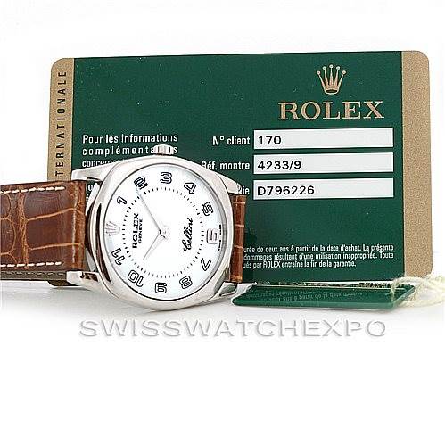 The image shows a Rolex Cellini 4233 Men's White Gold White Dial 4233 Men's White Gold White Dial watch with a brown leather strap and its accompanying authentication card, viewed from the front.