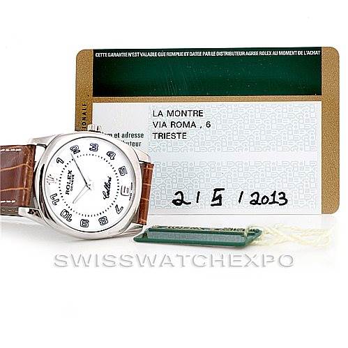 The image shows the front view of a Rolex Cellini 4233 Men's White Gold White Dial 4233 Men's White Gold White Dial watch alongside its certificate and a green tag.
