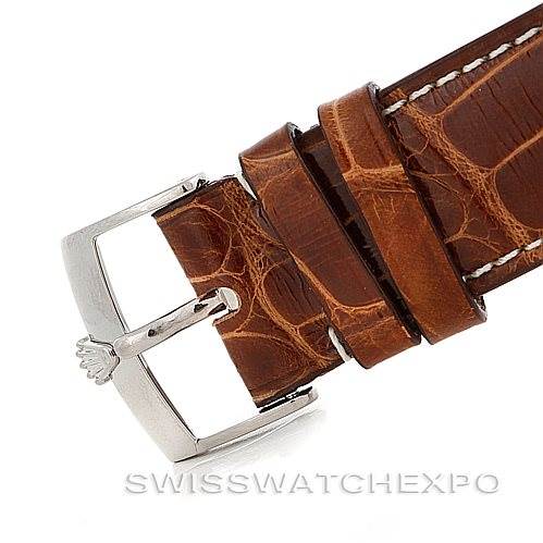 This image shows a close-up of a Rolex Cellini 4233 Men's White Gold White Dial 4233 Men's White Gold White Dial watch's brown leather strap with a silver buckle featuring the Rolex crown logo.