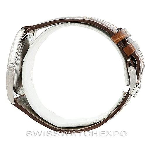 This image shows a side view of the Rolex Cellini 4233 Men's White Gold White Dial 4233 Men's White Gold White Dial watch, highlighting its case, crown, and brown leather strap.