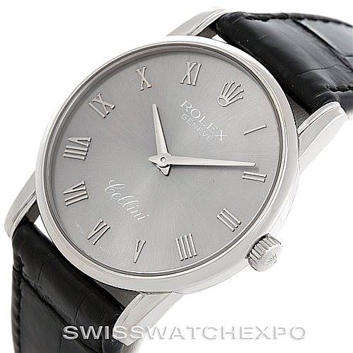 This image shows a Rolex Cellini 5116 Men's White Gold Grey Dial 5116 Men's White Gold Grey Dial watch from an oblique angle, displaying the face, Roman numerals, hands, crown, case, and leather strap.