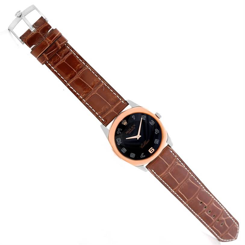 The Rolex Cellini 4233 Men's White Gold Black Dial 4233 Men's White Gold Black Dial watch is shown from a top-down angle, highlighting its face, bezel, crown, and leather strap.