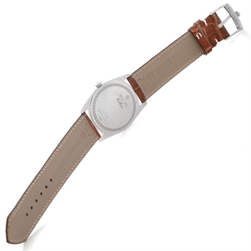 The image shows the back view of a Rolex Cellini 4233 Men's White Gold Black Dial 4233 Men's White Gold Black Dial watch with its leather strap and buckle.