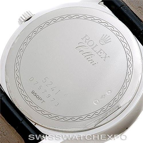 The image shows the back case of a Rolex Cellini 5241 Men
s Platinum Blue Dial 5241 Men
s Platinum Blue Dial model watch, featuring engravings and the brand
s logo.