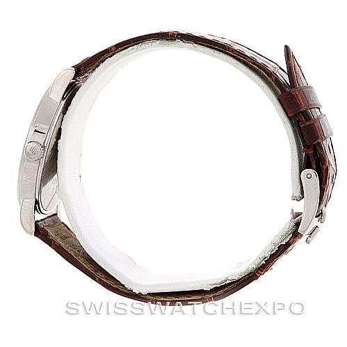 The Rolex Cellini 5115 Men's White Gold Brown Dial 5115 Men's White Gold Brown Dial model watch is shown from a side angle, highlighting the case, crown, and brown leather strap with buckle.