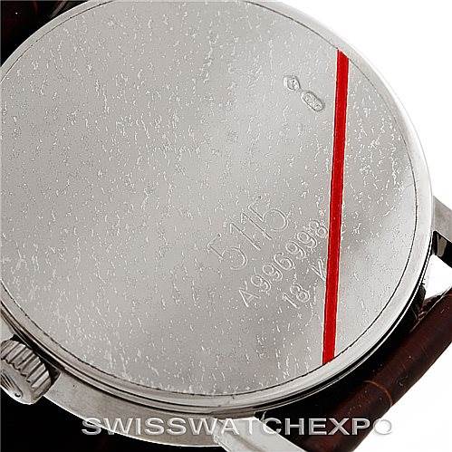 This image shows the back case of a Rolex Cellini 5115 Men's White Gold Brown Dial 5115 Men's White Gold Brown Dial watch at an angled view, featuring the crown and engraved details.