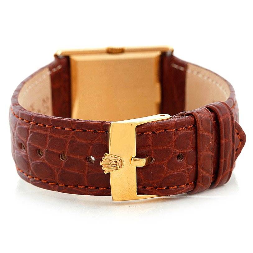 The image shows the back view of a Rolex Cellini 4016 Men's Yellow Gold Brown Dial 4016 Men's Yellow Gold Brown Dial watch, highlighting its leather strap and gold buckle.