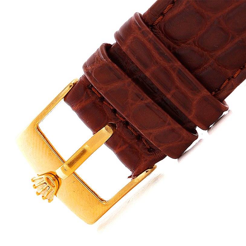 This image shows a close-up of the brown leather strap and gold buckle of a Rolex Cellini 4016 Men's Yellow Gold Brown Dial 4016 Men's Yellow Gold Brown Dial watch.