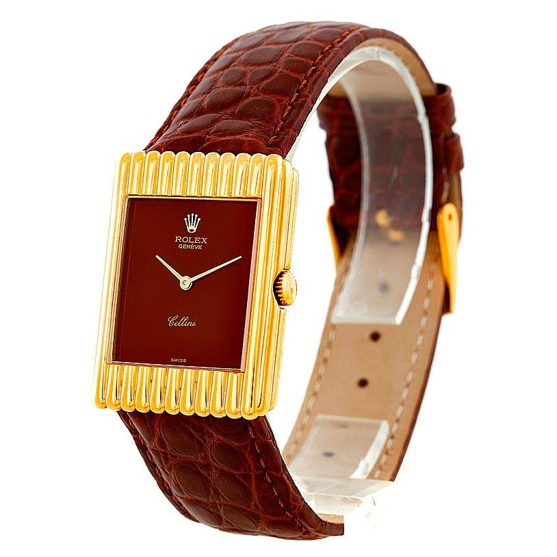 The Rolex Cellini 4016 Men's Yellow Gold Brown Dial 4016 Men's Yellow Gold Brown Dial watch is shown at a slight angle, highlighting its rectangular face, gold details, and brown leather strap.