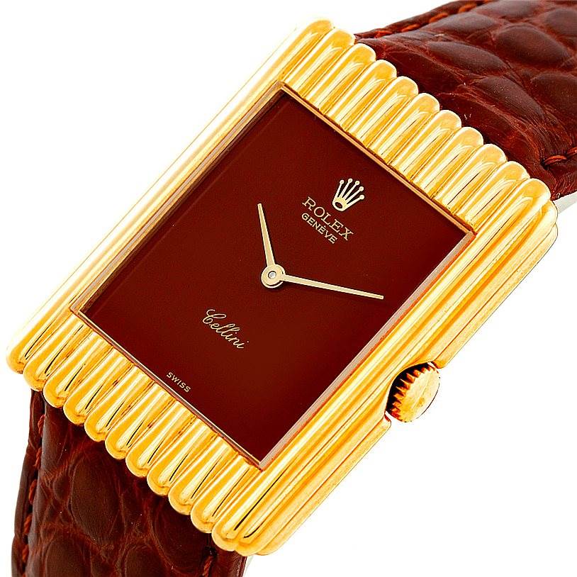This image shows a close-up of a Rolex Cellini 4016 Men's Yellow Gold Brown Dial 4016 Men's Yellow Gold Brown Dial watch, highlighting its rectangular gold case, burgundy dial, and brown leather strap.