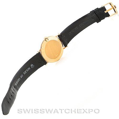 The image shows the back view of a Rolex Cellini 4112 Men's Yellow Gold White Dial 4112 Men's Yellow Gold White Dial watch, highlighting its leather strap and gold case.
