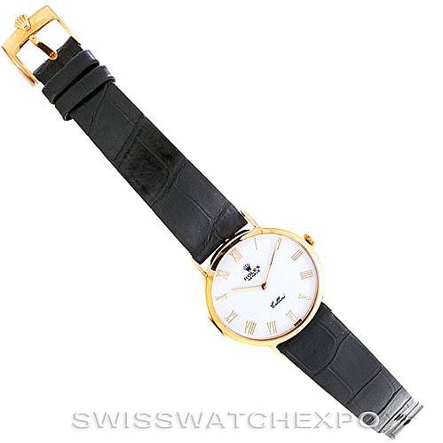 The image shows a top-down view of a Rolex Cellini 4112 Men's Yellow Gold White Dial 4112 Men's Yellow Gold White Dial watch, featuring its face, case, and leather strap with a buckle.