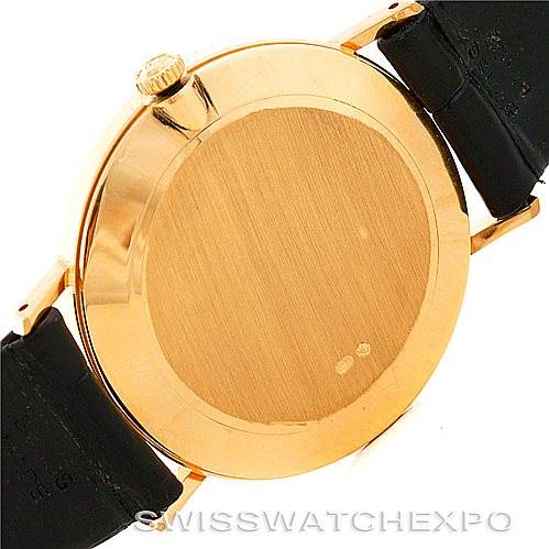 This image shows the back case and part of the leather strap of a Rolex Cellini 4112 Men's Yellow Gold White Dial 4112 Men's Yellow Gold White Dial watch.