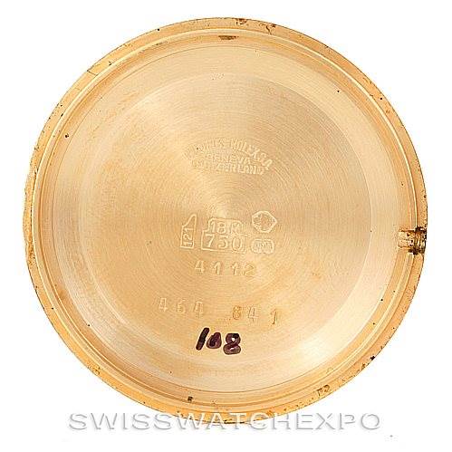 The image shows the inside of the case back of a Rolex Cellini 4112 Men's Yellow Gold White Dial 4112 Men's Yellow Gold White Dial watch, displaying various engravings and markings.