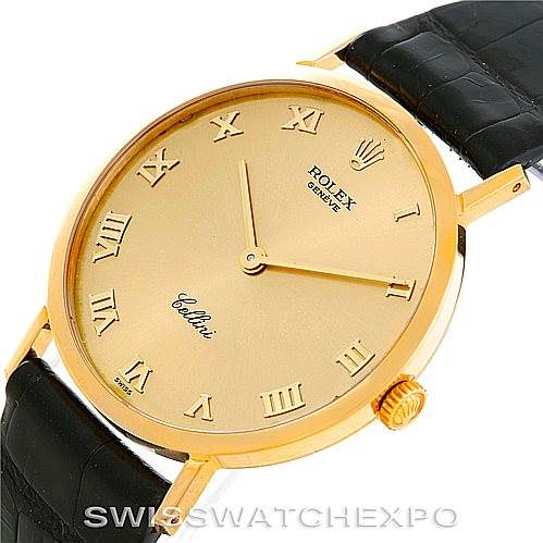 The image shows a close-up of the Rolex Cellini 4112 Men's Yellow Gold Champagne Dial 4112 Men's Yellow Gold Champagne Dial watch, highlighting its gold case, Roman numeral markers, and black leather strap.