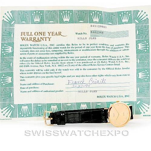 The image shows a Rolex Cellini 4112 Men's Yellow Gold Champagne Dial 4112 Men's Yellow Gold Champagne Dial watch with a full one-year warranty card, including the watch face, band, and clasp.