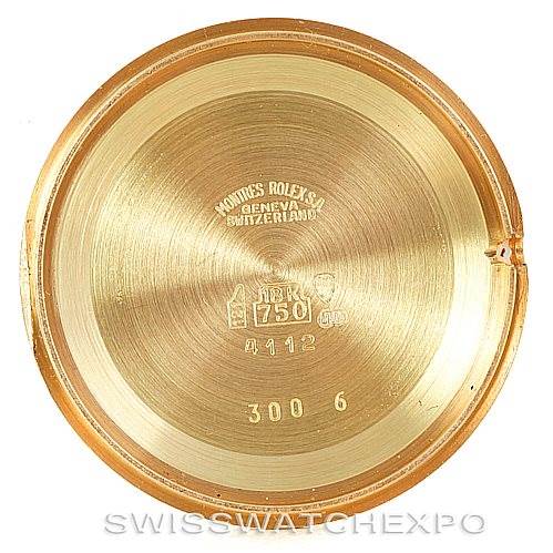 This image shows the inside of a Rolex Cellini 4112 Men's Yellow Gold Champagne Dial 4112 Men's Yellow Gold Champagne Dial watch case back, featuring model and certification engravings.