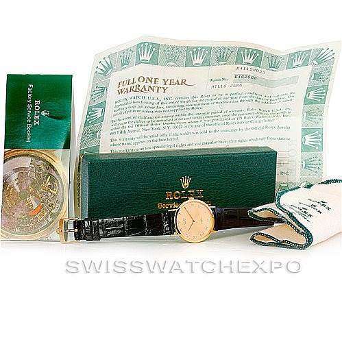 The image shows a Rolex Cellini 4112 Men's Yellow Gold Champagne Dial 4112 Men's Yellow Gold Champagne Dial watch with its box, warranty card, service pouch, and a polishing cloth, viewed from above.