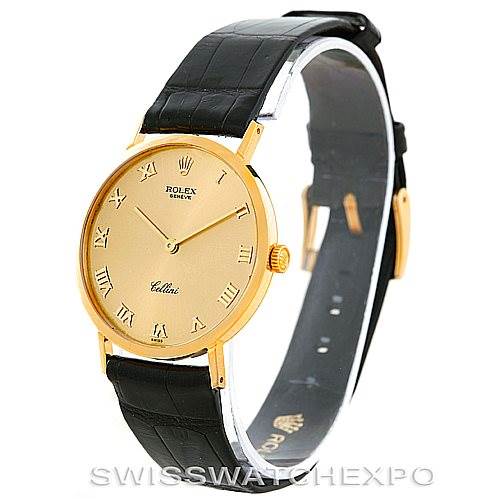 The Rolex Cellini 4112 Men's Yellow Gold Champagne Dial 4112 Men's Yellow Gold Champagne Dial watch is shown at an angle displaying the face, black strap, and gold casing.