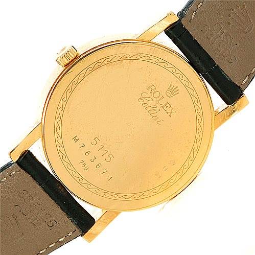 The image shows the back case of a Rolex Cellini 5115 Men's Yellow Gold  5115 Men's Yellow Gold  watch, clearly displaying its inscriptions and serial numbers.