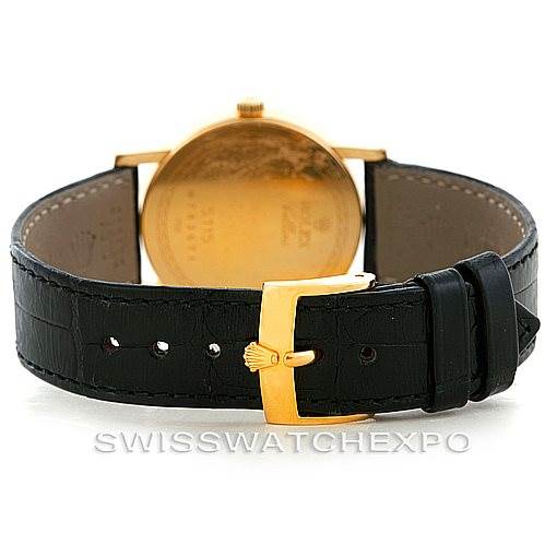 The image shows the rear view of a Rolex Cellini 5115 Men's Yellow Gold  5115 Men's Yellow Gold  watch, highlighting the back case and black leather strap with a gold buckle.