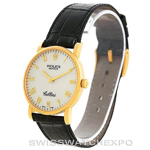 The image shows a Rolex Cellini 5115 Men's Yellow Gold  5115 Men's Yellow Gold  model watch, highlighting its face, bezel, crown, and black leather strap from an angled side view.