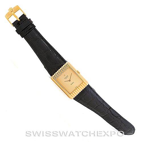 The image shows a Rolex Cellini 4016 Men's Yellow Gold Champagne Dial 4016 Men's Yellow Gold Champagne Dial watch laid flat, displaying its black leather strap, gold-tone rectangular case, and buckle.