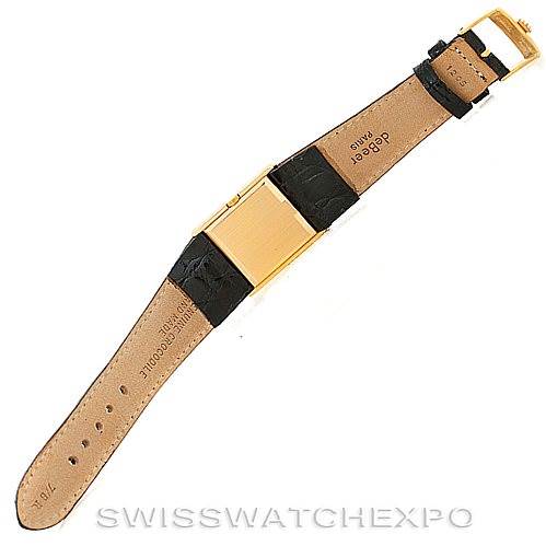 This image shows the back side of a Rolex Cellini 4016 Men's Yellow Gold Champagne Dial 4016 Men's Yellow Gold Champagne Dial watch, showcasing its black leather strap and gold clasp.