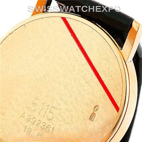The image shows the back case of a Rolex Cellini 5115 Men
s Yellow Gold Beige Dial 5115 Men
s Yellow Gold Beige Dial model, revealing its 18K gold stamp and serial number.