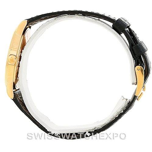 The Rolex Cellini 5115 Men
s Yellow Gold Beige Dial 5115 Men
s Yellow Gold Beige Dial watch is shown from a side angle, highlighting the gold case and black leather strap.