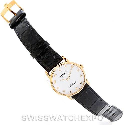 The Rolex Cellini 5116 Men's Yellow Gold Mother of Pearl Dial 5116 Men's Yellow Gold Mother of Pearl Dial watch is shown from a top-down angle, displaying the face, black leather strap, and gold buckle.