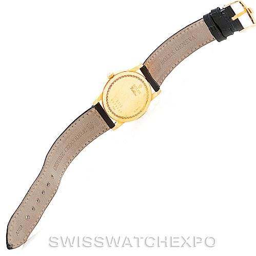 The image shows the back view of a Rolex Cellini 5116 Men's Yellow Gold Mother of Pearl Dial 5116 Men's Yellow Gold Mother of Pearl Dial watch, displaying the leather strap and gold case back.