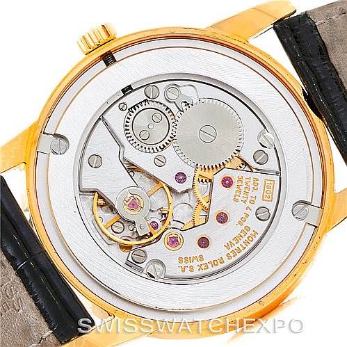 The image shows the back view of a Rolex Cellini 5116 Men's Yellow Gold Mother of Pearl Dial 5116 Men's Yellow Gold Mother of Pearl Dial watch, revealing its mechanical movement and internal components.