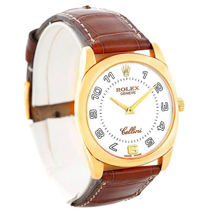 The image shows a Rolex Cellini 4233 Men's Yellow Gold White Dial 4233 Men's Yellow Gold White Dial watch at an oblique angle, highlighting its face, bezel, crown, and brown leather strap.