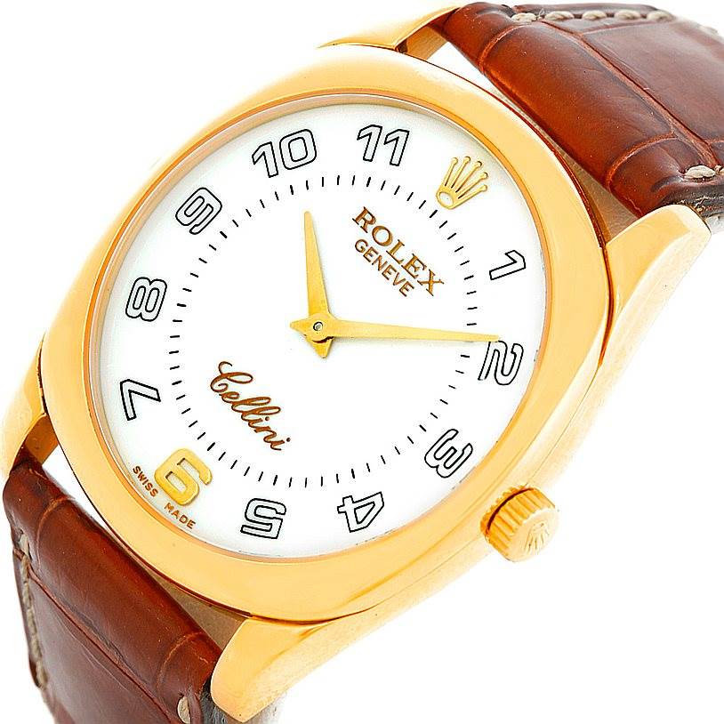 The image shows a close-up angled view of a Rolex Cellini 4233 Men's Yellow Gold White Dial 4233 Men's Yellow Gold White Dial watch, highlighting the face, crown, and leather strap.