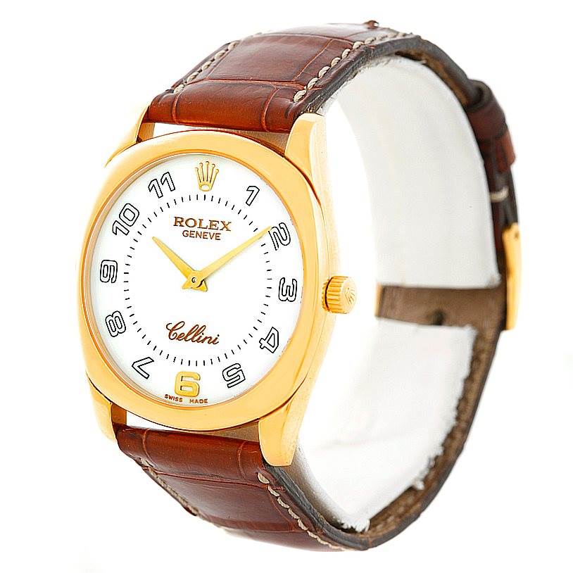 The Rolex Cellini 4233 Men's Yellow Gold White Dial 4233 Men's Yellow Gold White Dial watch is shown at a three-quarter angle, highlighting its case, dial, crown, and leather strap.