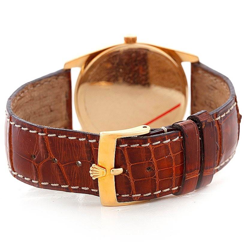 The image shows the back and strap of the Rolex Cellini 4233 Men's Yellow Gold White Dial 4233 Men's Yellow Gold White Dial watch, highlighting the clasp and leather band.