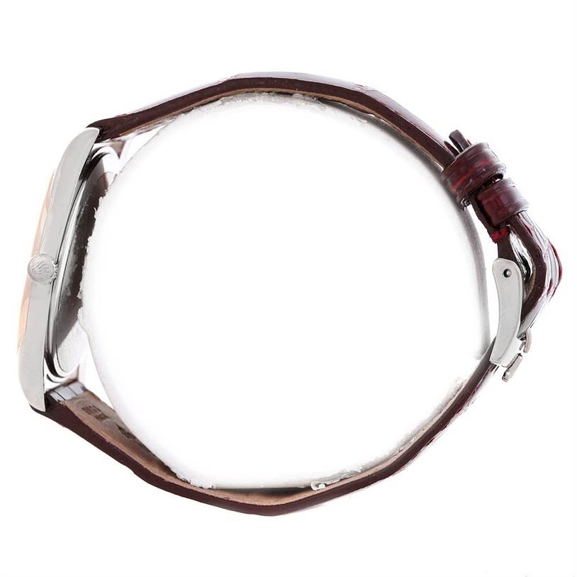 The image shows a side profile of a Rolex Cellini 4233 Men's White Gold White Dial 4233 Men's White Gold White Dial watch, highlighting the crown and leather strap with a buckle clasp.