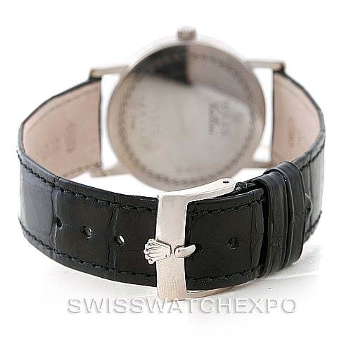 The image shows the back view of a Rolex Cellini 5115 Men's White Gold Black Dial 5115 Men's White Gold Black Dial watch, highlighting its black leather strap and silver clasp.