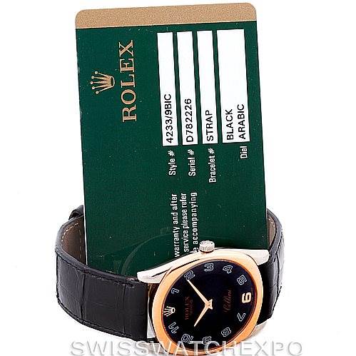 The photo shows a Rolex Cellini 4233 Men's White Gold Black Dial 4233 Men's White Gold Black Dial watch at a front angle with its black strap and an accompanying green warranty card.