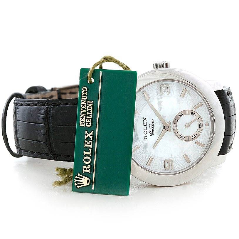 The Rolex Cellini 5240 Men's Platinum Mother of Pearl Dial 5240 Men's Platinum Mother of Pearl Dial watch is shown from a slightly angled front view, displaying the face and part of the leather strap with a branded tag.