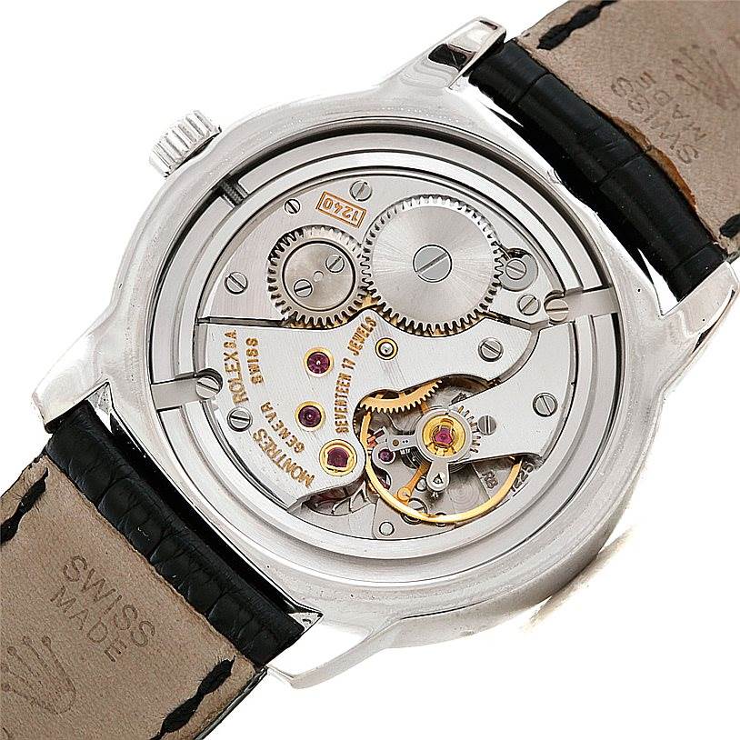 This image shows the back view of the Rolex Cellini 5240 Men's Platinum Mother of Pearl Dial 5240 Men's Platinum Mother of Pearl Dial watch, highlighting its intricate mechanical movement and gears.