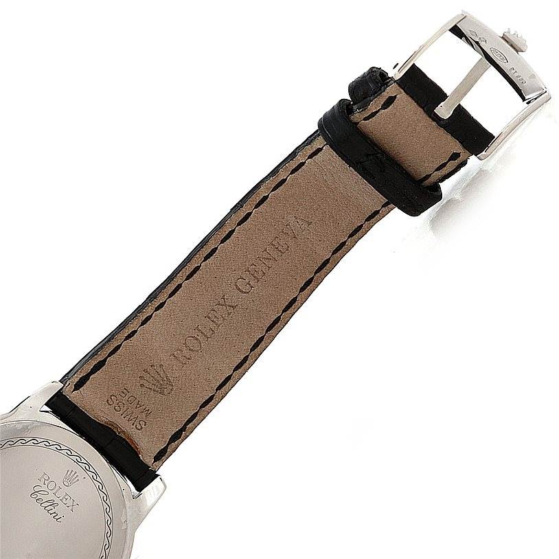 The image shows the back of a Rolex Cellini 5240 Men's Platinum Mother of Pearl Dial 5240 Men's Platinum Mother of Pearl Dial watch with a close-up of its leather strap and buckle.