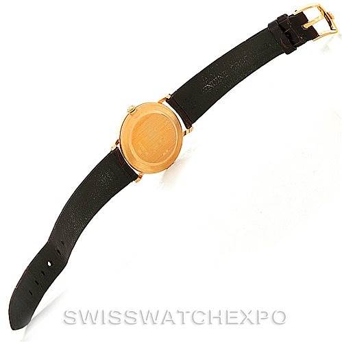 The image shows the back view of a Rolex Cellini 5112 Men's Yellow Gold Mother of Pearl Dial 5112 Men's Yellow Gold Mother of Pearl Dial watch with a black leather strap and gold clasp.