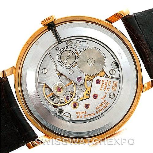 The image shows the intricate backside of a Rolex Cellini 5112 Men's Yellow Gold Mother of Pearl Dial 5112 Men's Yellow Gold Mother of Pearl Dial watch, focusing on its exposed mechanical movement.